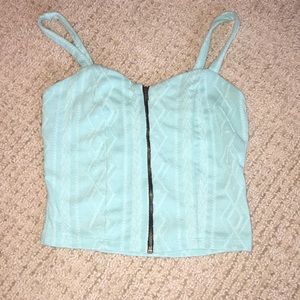 Size XS zip front teal crop top